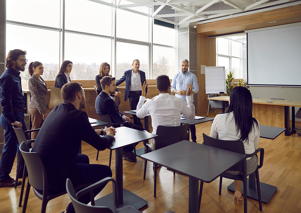 Employee Self Care Seminars with participants attending a seminar in a conference room