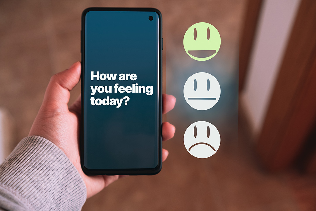 Mental Wellness Screening shown on a mobile phone with the question 'How are you feeling today?